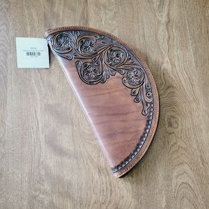 Brand new, still with tags! Genuine tooled leather taco clutch.